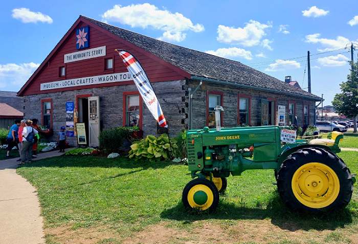 Mennonite Story Museum with a Green Farm Tractor